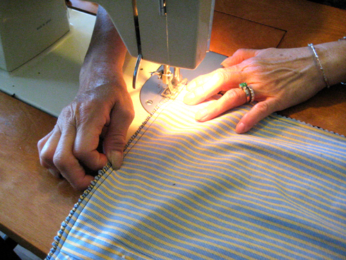 mom serging the edges of my shirt pillow